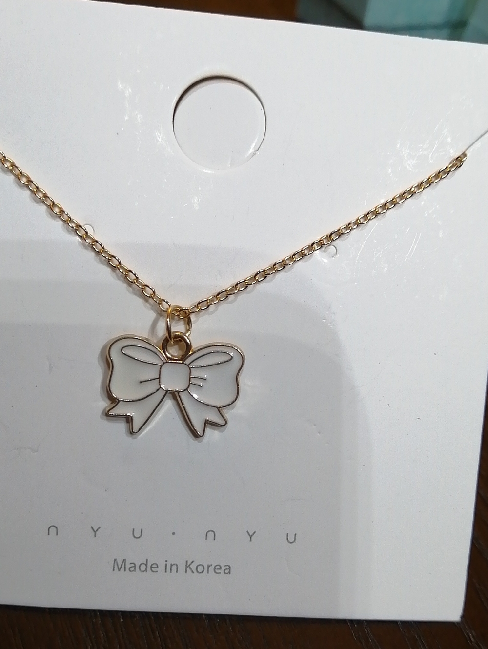 Made In Korea Gold Tone Necklace with White Enamel Bow Pendant